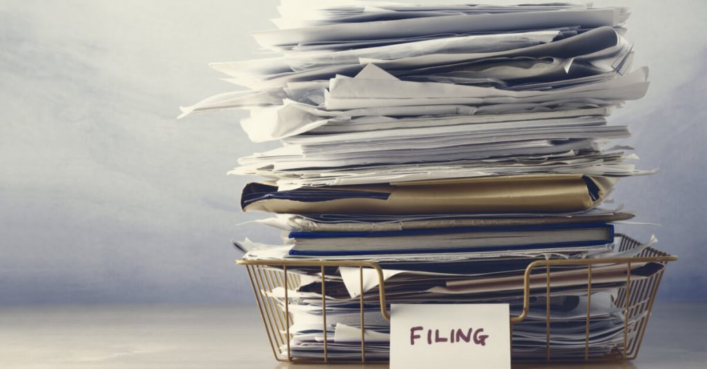 Use a filing system to help keep paperwork organised